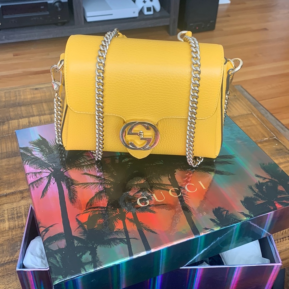Mustard yellow Gucci crossbody purse.